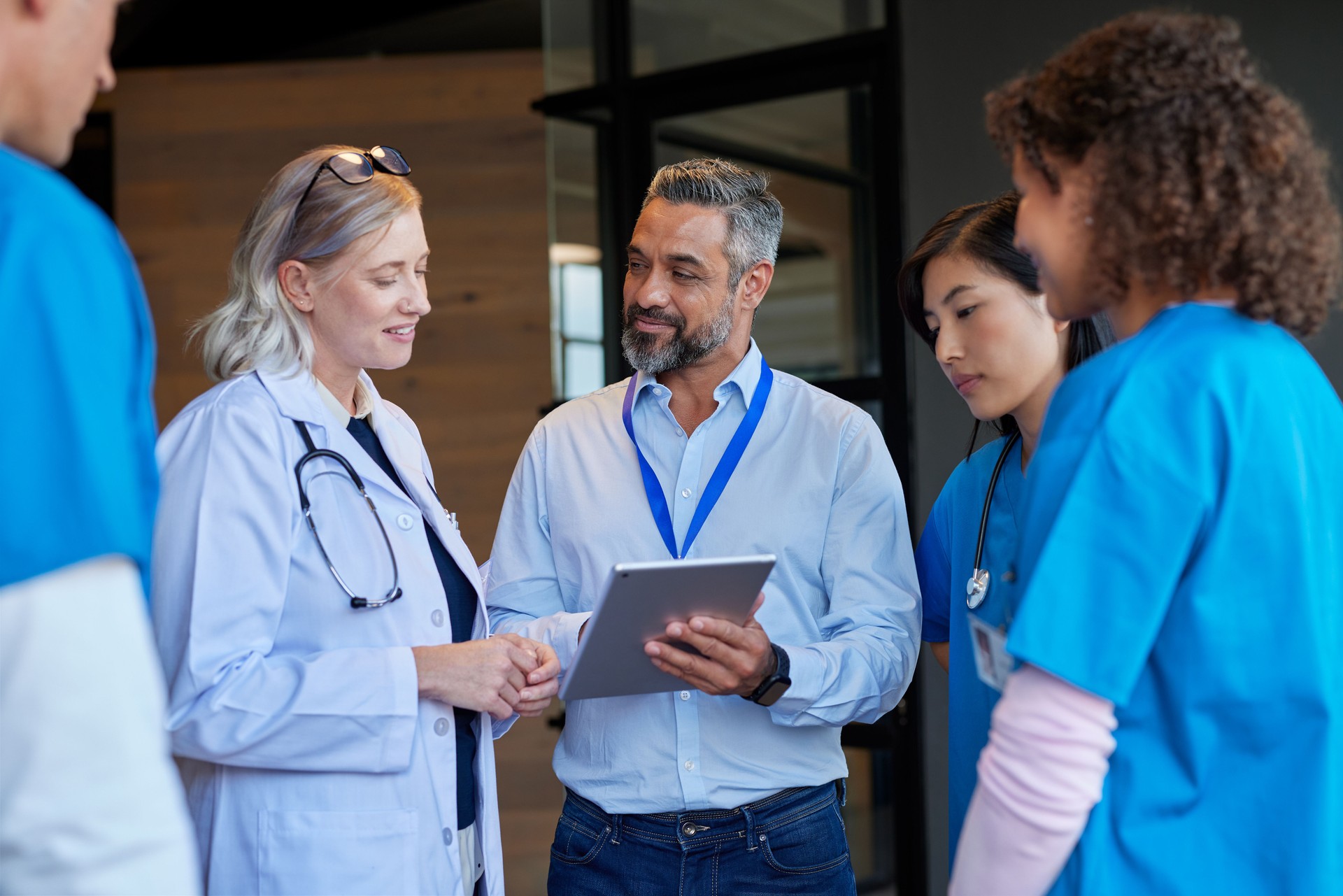 Multiethnic healthcare team meeting pharmaceutical representative