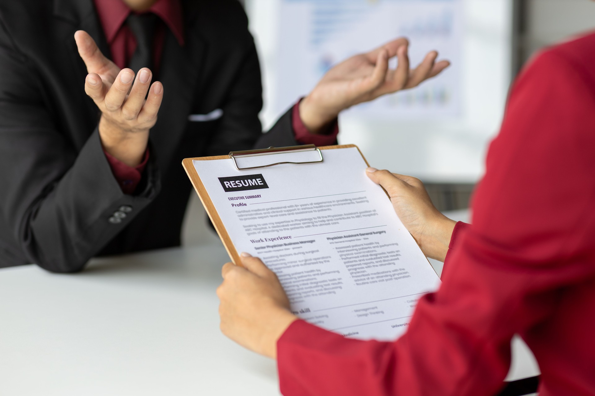 Job searching, Applicants submit application documents and resumes during job interviews in the office. Job interview